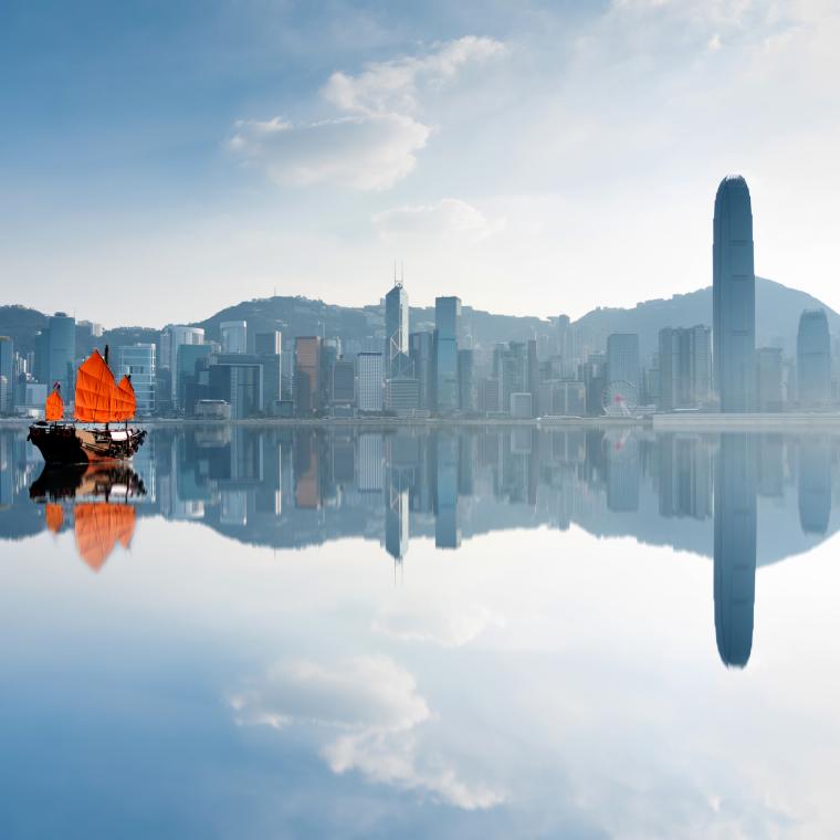 Red boat floating in Hong Kong