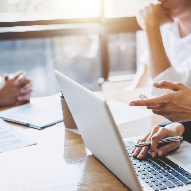 Business meeting analysing data