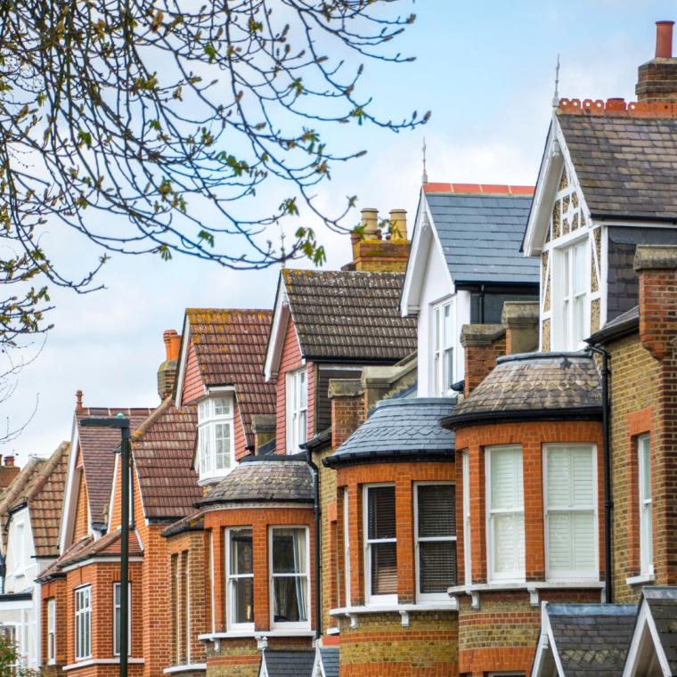 A street of red brick terraced houses in the UK