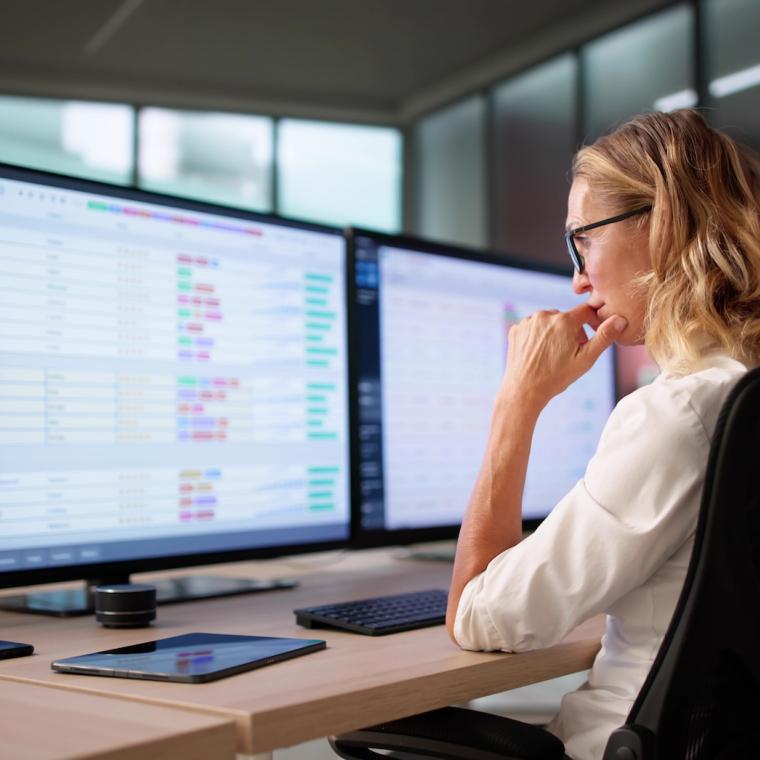 Woman investigating non compliance on computer