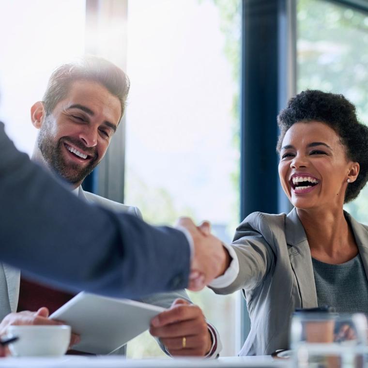 business people shaking hands in the office for a deal, collaboration or onboarding