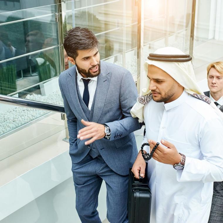 Middle Eastern colleagues discussing Ramadan