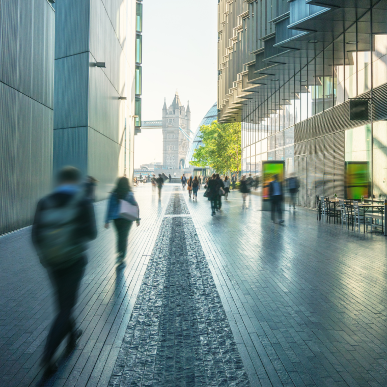 business people, modern buildings and Tower Bridge, London, UK 