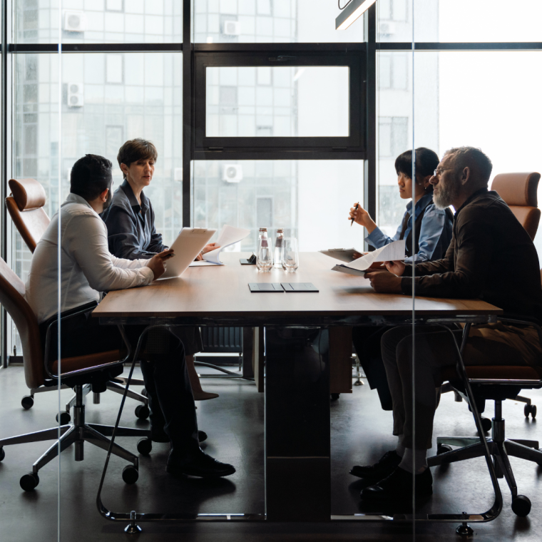 Professional confident multiethnic colleagues discussing work project in office