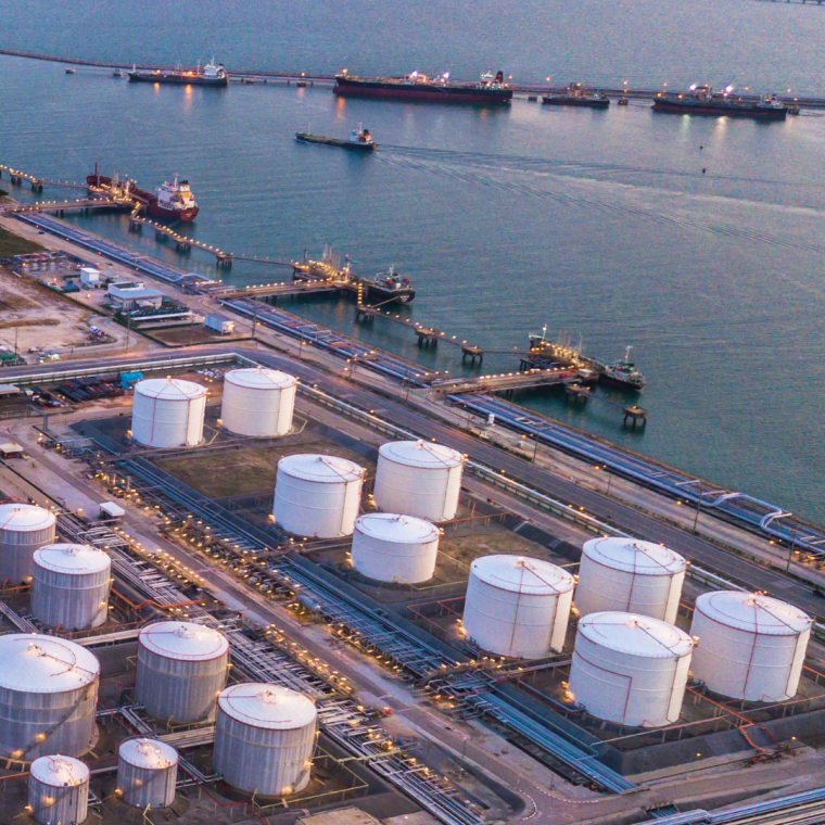 Aerial view oil terminal is industrial facility for storage of oil and petrochemical products ready for transport to further storage facilities. 