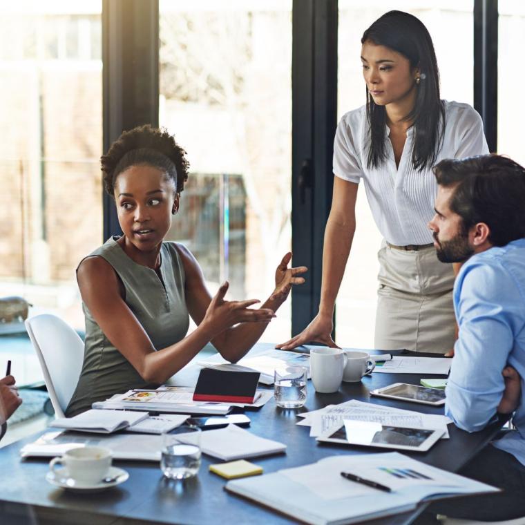 group of businesspeople having a meeting in a boardroom