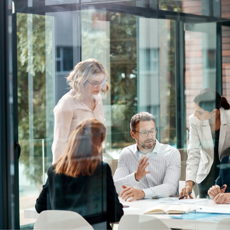 Window, business people or planning in meeting for paperwork, teamwork or collaboration together. Shareholders, investor or executive director speaking in discussion for feedback, review or project