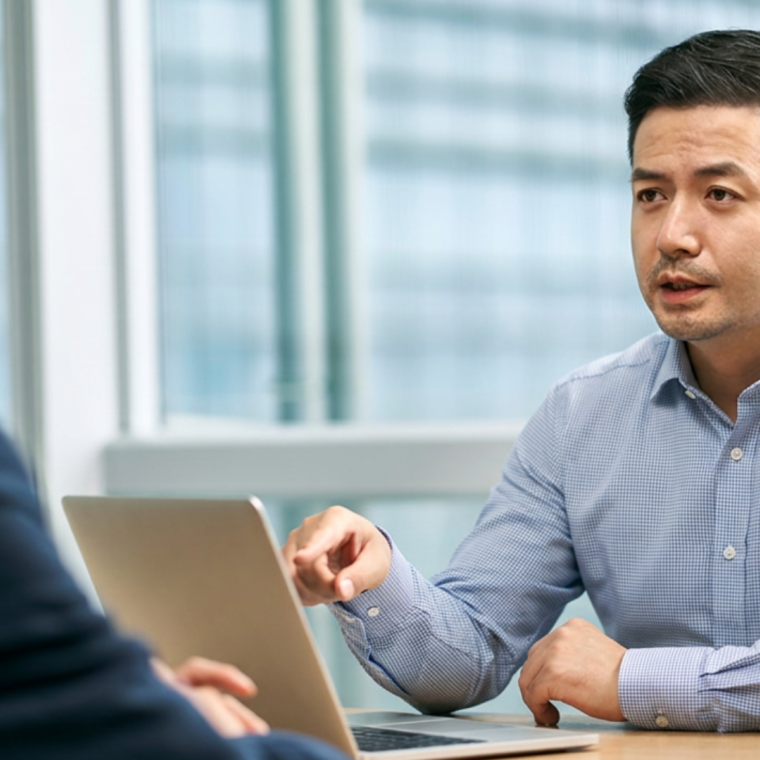 asian corporate executives discussing business in office