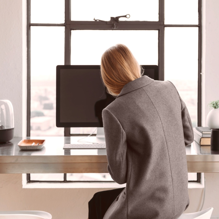 Professional woman working at a desk. 