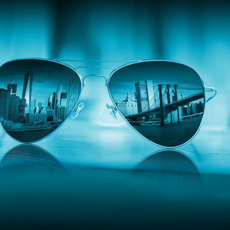 aviator glasses with city skyline reflected in the lenses