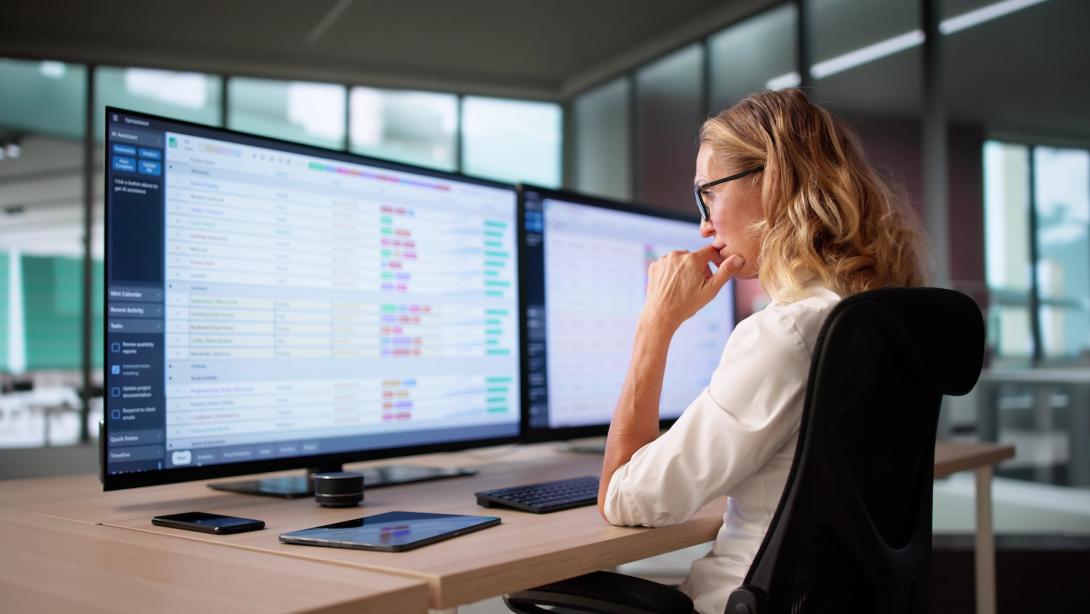 Woman investigating non compliance on computer