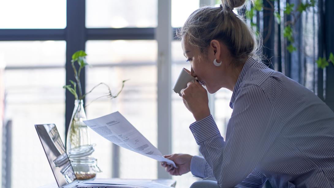 asian woman working from home looking at a model release