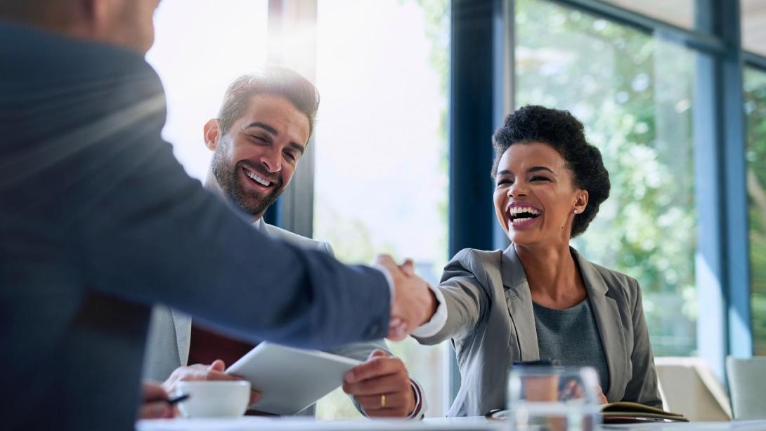 business people shaking hands in the office for a deal, collaboration or onboarding