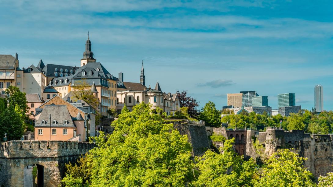 Horizontal Aerial panorama view of Luxembourg-City with the fortress wall, the Casemates, and Kirchberg skyline