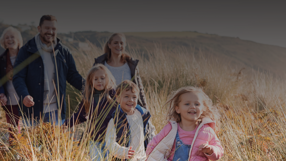 Family in a wheat garden walking