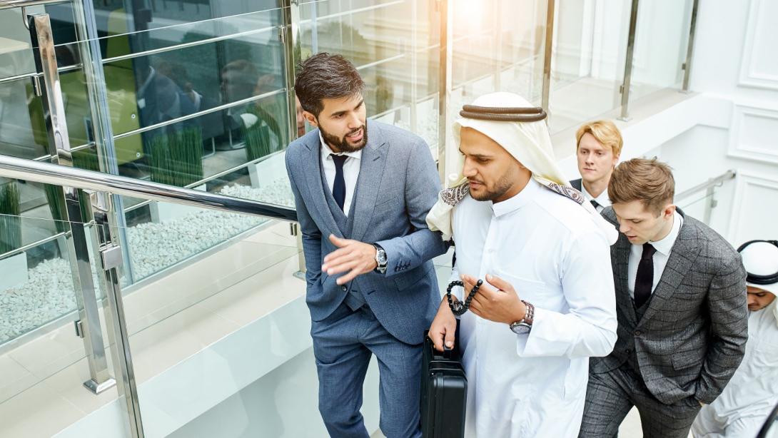 Middle Eastern colleagues discussing Ramadan