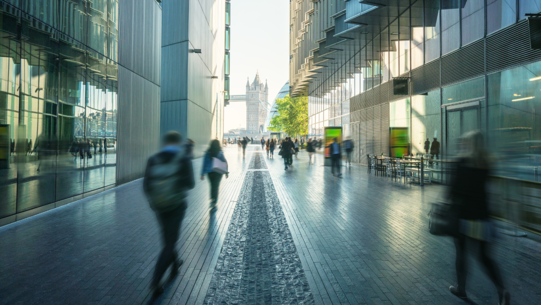 business people, modern buildings and Tower Bridge, London, UK 
