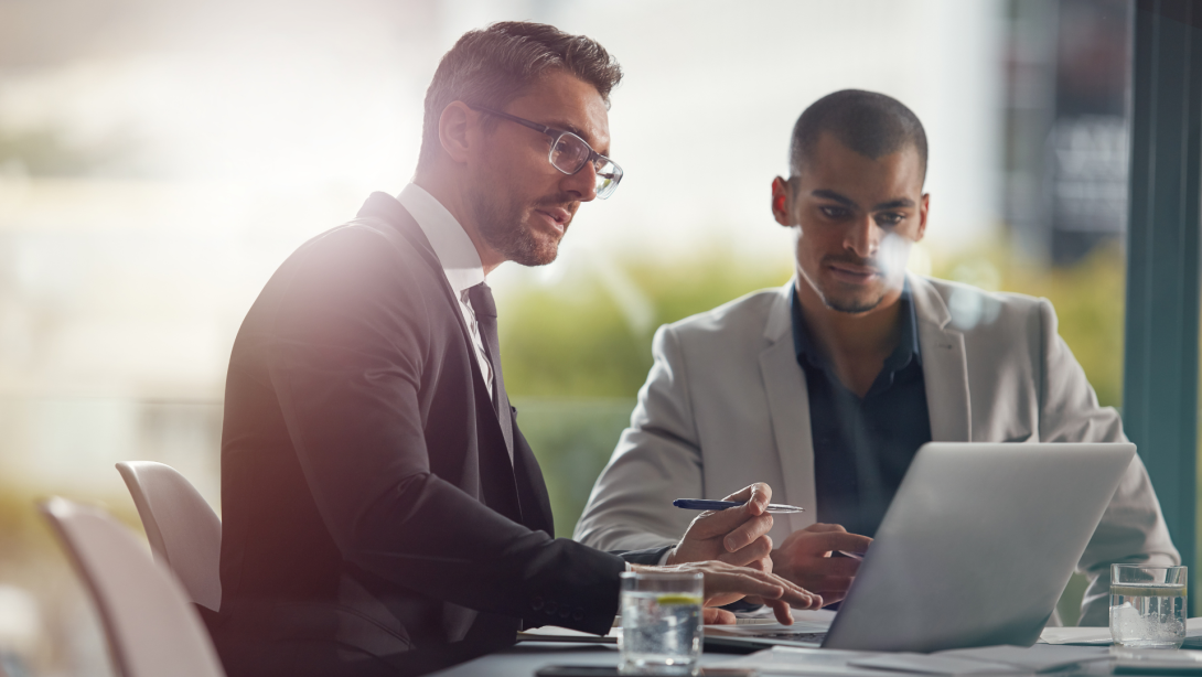 Business people, laptop and planning while reading email information online with lawyer and client . Men together in meeting discussion with company wifi internet to do research on case for advice