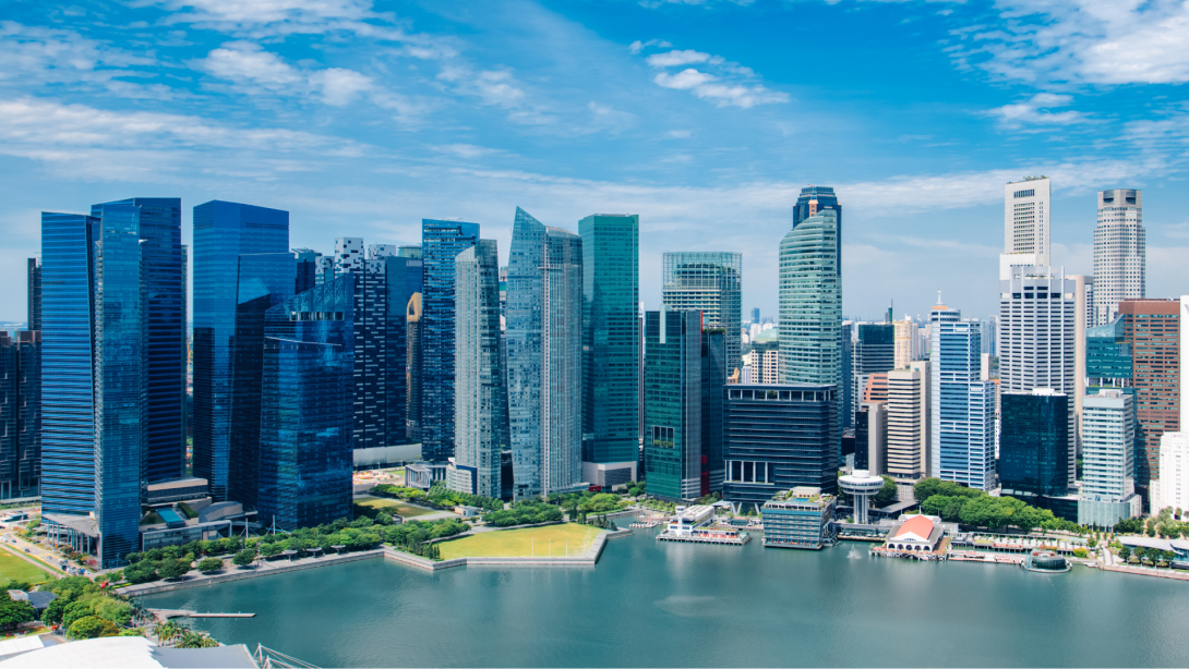 Singapore city skyline landscape at day blue sky. Business downtown district and Marina Bay view. Urban skyscrapers cityscape 
