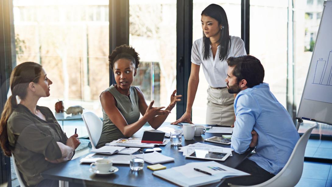 group of businesspeople having a meeting in a boardroom