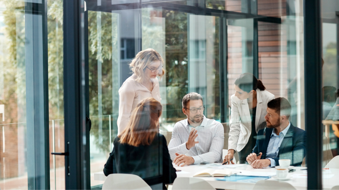 Window, business people or planning in meeting for paperwork, teamwork or collaboration together. Shareholders, investor or executive director speaking in discussion for feedback, review or project