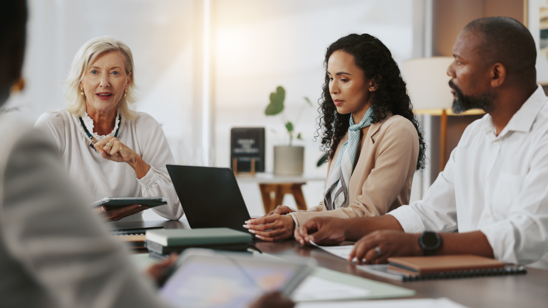 Laptop, teamwork and meeting with business people in office for strategy, project and research. Company growth, market report and brainstorming with employees in agency for discussion and planning