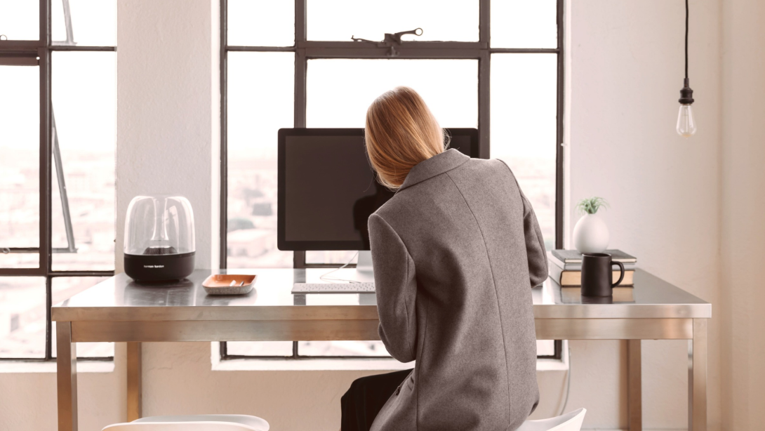 Professional woman working at a desk. 