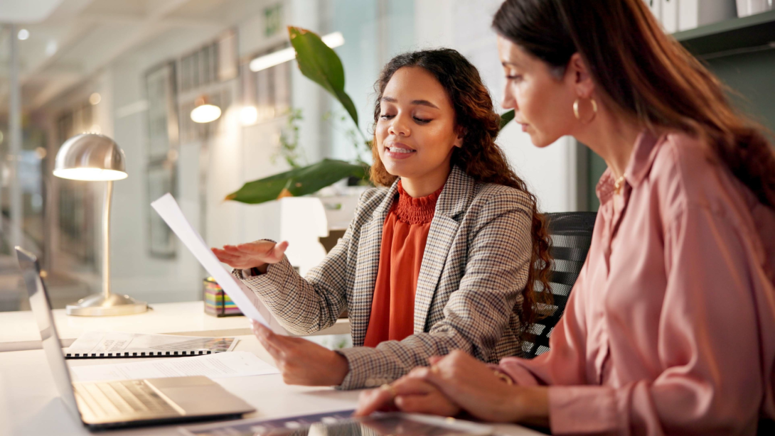Business office, women team and talking with paperwork for policy review, laptop or corporate meeting